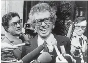  ?? ASSOCIATED PRESS ARCHIVES ?? In 1980, Ken Taylor, Canadian ambassador to Iran, laughs as he answers questions during a meeting with journalist­s outside the Canadian Embassy in Paris.