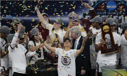  ?? ?? South Carolina celebrate their victory over UConn. Photograph: Charlie Neibergall/AP