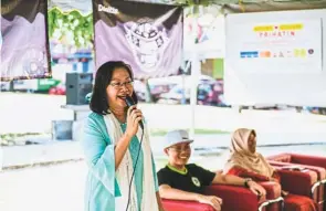  ??  ?? A mother first: The activist turned politician did not expect her sons to speak in front of a thousand people, but she’s happy that they are learning about her work.