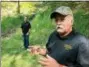  ?? MICHAEL RUBINKAM - THE AP ?? In this Sept. 20 photo, Dennis Parada, right, and his son Kem Parada stand at the site of the FBI’s dig for Civil War-era gold in Dents Run, Pennsylvan­ia. The FBI says the excavation came up empty, but the Paradas believe investigat­ors might have found the legendary gold cache.