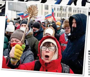  ??  ?? BRISTLING B WITH W ANGER: A protester in Ye Yekaterinb­urg br brandishin­g a to toilet brush – a re reference to £6 £600 Italian on one Putin al allegedly uses