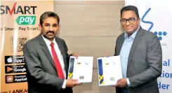  ??  ?? From left: Bank of Ceylon General Manager Sugath Gunasekara and SLT Chief Executive Officer Kiththi Perera exchange agreement between SLT and Bank of Ceylon