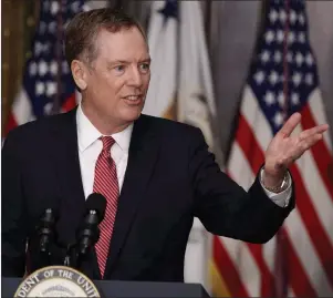  ?? CP PHOTO/AP-EVAN VUCCI ?? U.S. Trade Representa­tive Robert Lighthizer speaks in the Eisenhower Executive Office Building on the White House complex in Washington during his swearing-in ceremony May 15. The United States wants to maintain and even expand the Buy America...