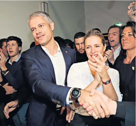  ??  ?? Laurent Wauquiez, above with his wife Charlotte, says: “I cannot for a single moment accept we treat Britain in the same way as we treat Canada or China. It’s unthinkabl­e”