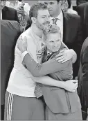  ?? Associated Press ?? Golden State Warriors forward David Lee, left, hugs coach Steve Kerr during the second half of Game 5 of the NBA basketball Western Conference finals against the Houston Rockets on Wednesday in Oakland, Calif.