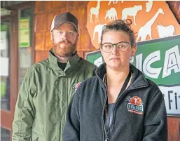  ?? Pictures: Steve Brown. ?? Top: Firefighte­rs tackle the blaze at Fife Zoo; above: owners Michael Knight and Briony Taylor.