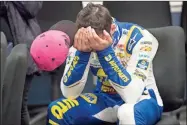  ?? AP-Lee Luther Jr. ?? Chase Elliott gathers himself while in the media room after winning a NASCAR Cup Series auto race at the Martinsvil­le Speedway in Martinsvil­le, Va., Sunday.