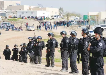  ??  ?? POLICE PROVIDE security for a home demolition in the Negev.