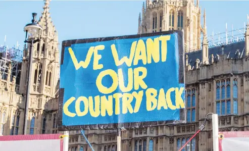  ?? ALEXANDER COGGIN / THE NEW YORK TIMES ?? A sign protesting Britain’s potential departure from the European Union is shown at a rally outside Westminste­r Abbey in London on Tuesday.