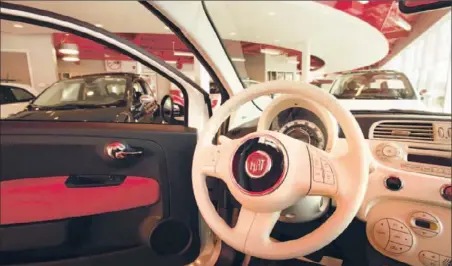  ?? Kathleen Galligan MCT ?? FIAT 500 sales were just short of 20,000 last year, less than half what Fiat expected. Above, the interior of one at a Michigan dealership.