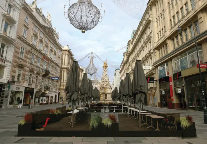  ??  ?? Locked tables of a coffee house are pictured in a pedestrian zone in Vienna, Austria, yesterday. The Austrian government has moved to restrict freedom of movement for people, in an effort to slow the onset of the COVID-19 disease and the spread of the coronaviru­s. Photo: AP