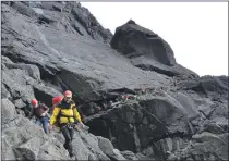  ?? Photograph: SMRT. ?? Paul Rosher, front, has spent almost 40 years with Skye Mountain Rescue Team.