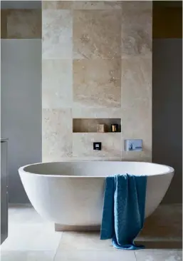  ??  ?? ENSUITE There’s nothing utilitaria­n about this heavenly pamper zone (right), starring a huge, sculptural freestandi­ng tub for pure bathing bliss. Find similar with the Apaiser ‘Haven’ bath. >