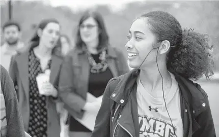  ?? ALGERINA PERNA/BALTIMORE SUN PHOTOS ?? Meyerhoff Scholar Tania Evans gives a tour of the UMBC campus to prospectiv­e students. She is a graduate of the elite STEM program at Eleanor Roosevelt High School in Greenbelt and will continue her studies at Georgia Tech.