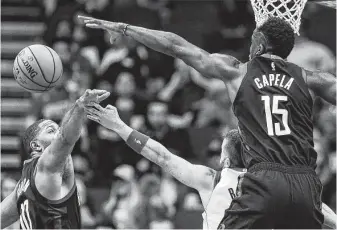  ?? Brett Coomer / Staff photograph­er ?? Guard Eric Gordon, left, and center Clint Capela, right, will remain with the Rockets for the time being. But the two were subjects of trade discussion­s.