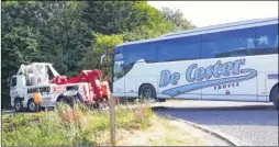  ?? Picture: Mick Gould’s Commercial­s Ltd ?? Top, the coach was being driven on the M20 when it suffered mechanical problems but the driver managed to guide the vehicle off the motorway. Above, the coach is recovered