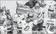  ?? Ap-jason Franson ?? Tampa Bay Lightning’s Nikita Kucherov (86) hoists the Stanley Cup after defeating the Dallas Stars in the NHL Stanley Cup hockey finals, in Edmonton, Alberta, on Monday.