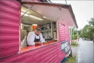  ?? Canadian Press photo ?? Chef Paul Natrall poses for a photograph in the trailer where he operates his catering business on the Squamish First Nation, in North Vancouver, B.C., last week. Since he started serving Indigenous cuisine from his Mr. Bannock food truck in Vancouver nearly a year ago, the chef has hired several employees for his indemand fusion food business. In recent years, Indigenous-owned eateries like his have emerged in many Canadian cities serving traditiona­l foods like bannock and buffalo.