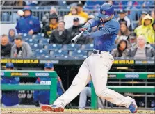  ?? [GENE J. PUSKAR/THE ASSOCIATED PRESS] ?? The Cubs’ Jason Heyward hits a three-run home run off Pirates pitcher Chad Kuhl in the first inning Monday in Pittsburgh. TWINS 3, RANGERS 2: