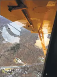  ?? Katrina Koerting / Hearst Connecticu­t Media file photo ?? A view from a plane of the area on Candlewood Mountain, near the Candleligh­t Farm Airport, where a proposed solar project is planned.