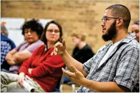  ?? TOM MCCARTHY JR. / FOR AMERICAN-STATESMAN ?? Manuel Muñoz, president of the Austin League of United Latin American Citizens, speaks to representa­tives of the 2018 bond task force about his concerns at the Little Walnut Creek Library last week.