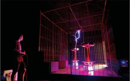  ?? Staff photo by Evan Lewis ?? Eric Goodchild tunes the Tesla coil he designed for the new exhibit at Discovery Place in downtown Texarkana. The twin solid-state coils are being donated to the museum through the Tesla Coil Museum Exhibit Program. The opening is July 10th.