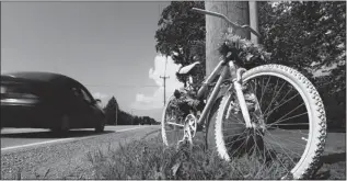  ??  ?? Windsor Star files A “ghost bike” painted flat white, chained to a light pole on Country Road 34
near Leamington, serves as a memorial to killed cyclist Kyle Peters.