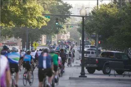  ?? File photo ?? Hundreds of riders fill Broad Street during last year’s Up the Creek event. This year’s event will take place April 28 staring and ending at the Town Green in downtown Rome. The Seven Hills Performing Arts Festival will also bring folks to the downtown...