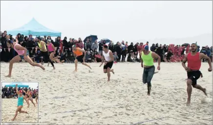  ?? PICTURES: TOPFOTO.NET ?? IN THE PINK: Jonathan Rorke, left, dips to beat local favourite Ryle de Morny, extreme right, in a photo finish to take the honours in the 90m beach sprint at the General Tire LifeSaving SA National Interclub Championsh­ips at Camp’s Bay in Cape Town...