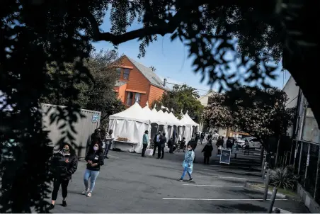  ?? Stephen Lam / The Chronicle ?? The state’s reopening plan is contingent on having enough doses for neighborho­od vaccinatio­n sites like this one in the Excelsior district of San Francisco. State officials expect to have enough for anyone over 16 who wants to be vaccinated.