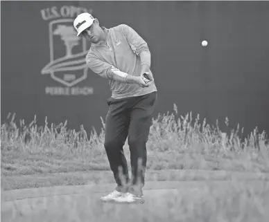  ??  ?? Gary Woodland chips while on the 17th green during the final round of the U.S. Open on June 16 in Pebble Beach, Calif. Woodland’s lob wedge from on the green was among the defining shots of the year.