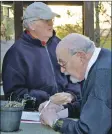  ??  ?? Robert Campbell-Preston and Romano Capocci recording the day’s catches at the weigh-in.