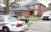  ?? CP PHOTO ?? Police cars remain parked outside of the Toronto area home of Alek Minassian in Richmond Hill, Ont., on Tuesday.