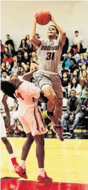  ?? Jimmy Loyd photos / For the Chronicle ?? Braxton Lovings, left, and Anthony Johnson lead the Dawson boys back into the playoffs this month.