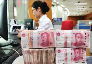  ??  ?? China’s yuan has lost more than seven per cent against the dollar since the end of the first quarter. — AFP