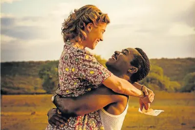  ??  ?? LOVE AGAINST THE ODDS: Rosamund Pike and David Oyelowo star as British insurance clerk Ruth Williams and heir to the Bechuanala­nd throne Seretse Khama in the romantic true-life drama ‘A United Kingdom’