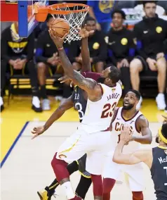  ??  ?? LeBron James (front) of the Cleveland Cavaliers attempts a layup against the Golden State Warriors during the third quarter in Game 2 of the 2018 NBA Finals at ORACLE Arena in Oakland, California. — AFP photo
