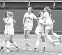  ?? NWA Democrat-Gazette/BEN GOFF • @NWABENGOFF ?? Fayettevil­le’s Morganne Browning (right) jumps into the arms of teammate Georgia Templeton (second from right) on Friday as Fayettevil­le players celebrate Templeton’s goal against Springdale at Harmon Stadium in Fayettevil­le.