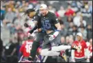  ?? Associated Press ?? NFC tight end George Kittle (85) celebrates a touchdown against the AFC with NFC wide receiver Justin Jefferson during the flag football event at the NFL Pro Bowl, Sunday, in Las Vegas.