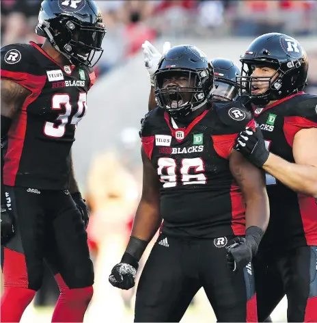  ?? JUSTIN TANG/THE CANADIAN PRESS ?? Mike Wakefield and his Ottawa Redblacks teammates had a lot to celebrate against the Roughrider­s on Thursday.