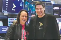  ?? RICHARD DREW, THE ASSOCIATED PRESS ?? T-Mobile CEO John Legere, left, and Sprint CEO Marcelo Claure pose for photos on the floor of the New York Stock Exchange.