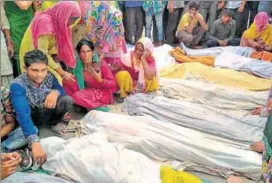  ?? PTI ?? People mourn near the bodies recovered from the Yamuna in Uttar Pradesh on Thursday.