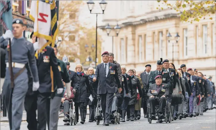  ?? ?? PARADE Veterans marching to the service at the Remembranc­e Sunday event in Guildhall Square. Inset below, many mourned much-loved city barmaid Dee Skelton