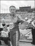  ?? JOHN SLEEZER/TRIBUNE NEWS SERVICE ?? NASCAR driver Kevin Harvick is congratula­ted after winning the pole position during qualifying on May 11 in Kansas City, Kan.