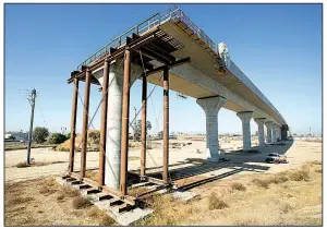  ?? AP file photo ?? An elevated section of the high-speed rail project awaits further constructi­on in Fresno, Calif., last month. Officials have raised the projected cost of the first phase of California’s bullet train project from about $6 billion to $10.6 billion.
