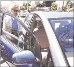  ?? ARIC CRABB — STAFF PHOTOGRAPH­ER ?? Paula Thompson, left, gets into a car driven by volunteer Barbara Saunders, right, from the Get Up & Go paratransi­t service after a physical therapy appointmen­t on July 11 in San Mateo.