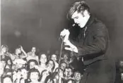  ?? RCA VICTOR VIA AP ?? Elvis Presley performs at the Mississipp­i-Alabama State Fair, in Tupelo, Miss., on Sept. 27, 1956.