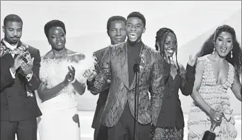  ?? FREDERIC J. BROWN/GETTY-AFP 2019 ?? Chadwick Boseman, center, speaks at the Screen Actors Guild Awards along with “Black Panther” cast members Michael B. Jordan, left, Danai Gurira, center, Lupita Nyong’o, second from right, and Angela Bassett, right. Boseman died Friday.