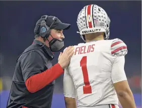  ?? Kevin C. Cox / Getty Images ?? Ohio State coach Ryan Day has teamed with quarterbac­k Justin Fields to get the Buckeyes clicking. They average 43.4 points per game.