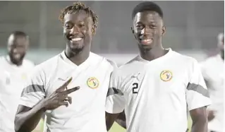  ?? — AFP ?? Senegal’s forward Famara Diedhiou (L) and defender Formose Mendy pose during a training session at Al Thumama Stadium in Doha, on the eve of the Qatar 2022 World Cup match against the Netherland­s.